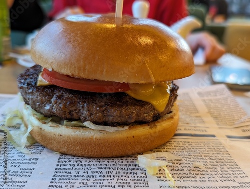 Close up Hamburger on a table on old paper.