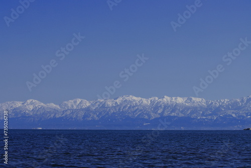 (富山県)冬の雨晴海岸から望む立山連峰 photo