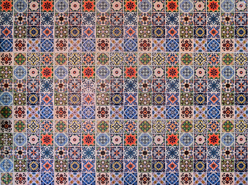 Closeup of Beautiful Colorful vintage ceramic tiles patterns wall decoration for interior home or rustic ceramic wall tile design at Thailand.