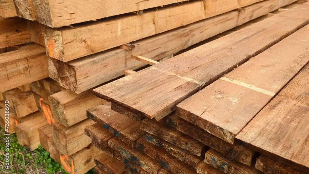 processed wooden boards lie stacked processed wooden boards lie stacked