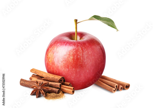 Aromatic cinnamon sticks, anise star and red apple isolated on white