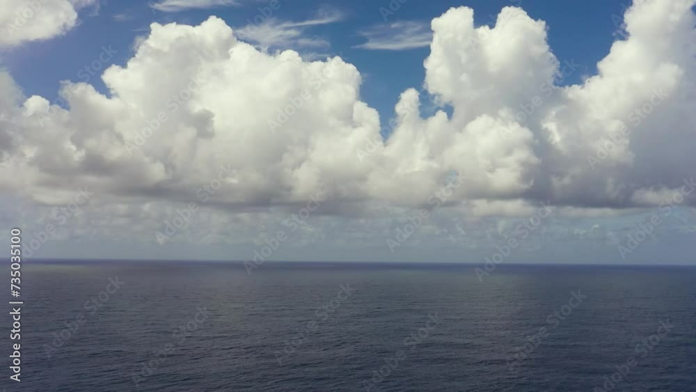 Tropical blue sea and blue sky with clouds. Seascape, aerial view. Flight over the sea. Tropical blue sea and blue sky with clouds. Seascape, aerial view. Flight over the sea.