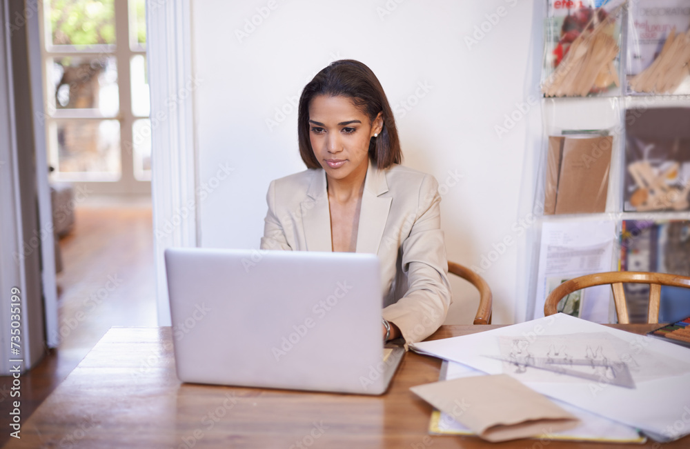 Black woman, table and typing on laptop for small business, work from home and thinking of idea to design. African female owner, technology and research for styling, career and entrepreneur. Black woman, table and typing on laptop for small business, work from home and thinking of idea to design. African female owner, technology and research for styling, career and entrepreneur.