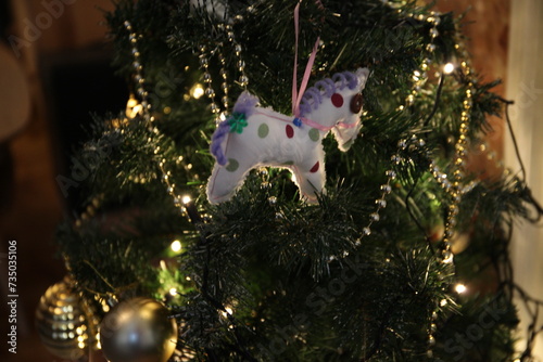 Handmade horse toy on a Christmas tree