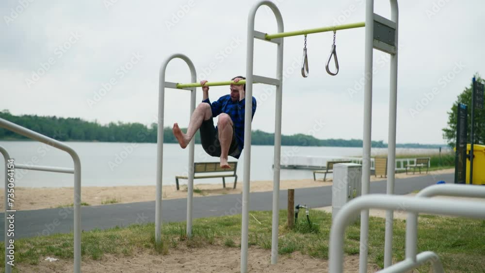 Young strong man exercising on the beach Young strong man exercising on the beach