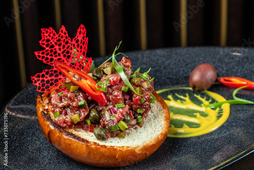 Gourmet tartar raw from beef fillet photo