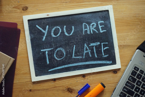 You are to late written on a board on a desk