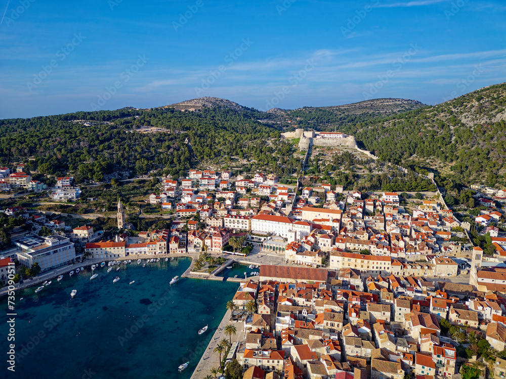 Aerial view of Hvar city in the Island of Hvar in Croatia. Famous for having an incredible nightlife scene, alongside its renowned historic town center and natural landscapes.