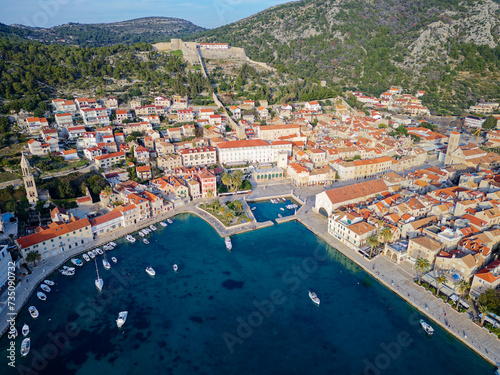 Aerial view of Hvar city in the Island of Hvar in Croatia. Famous for having an incredible nightlife scene, alongside its renowned historic town center and natural landscapes. © stu.dio