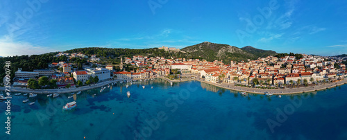 Fototapeta Naklejka Na Ścianę i Meble -  Aerial view of Hvar city in the Island of Hvar in Croatia. Famous for having an incredible nightlife scene, alongside its renowned historic town center and natural landscapes.