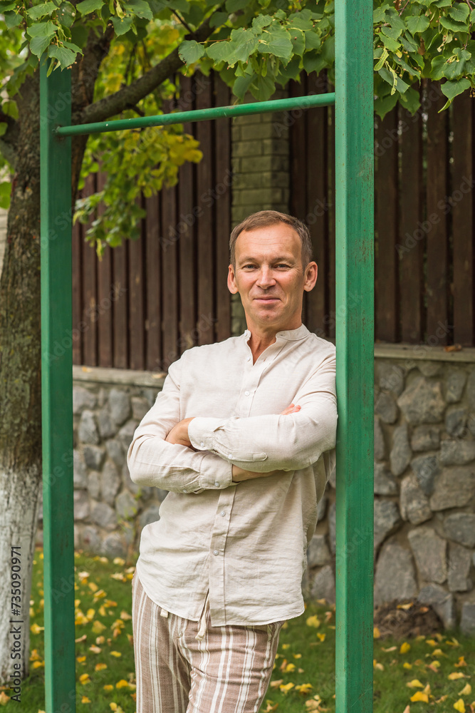 Mature European man with a good mood, outdoor portrait at park . The concept of life after 50-55 years old Mature European man with a good mood, outdoor portrait at park . The concept of life after 50-55 years old