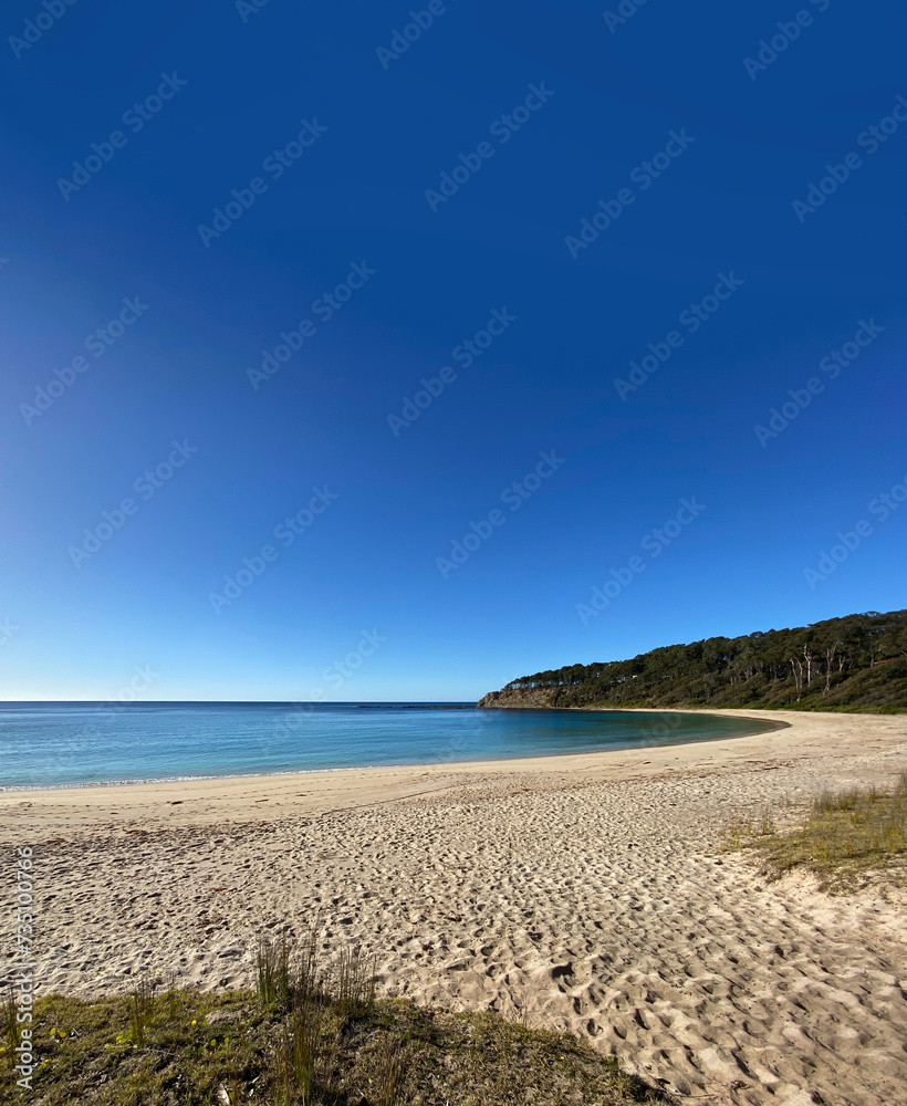 Island beach and sea. View of bay, sand, waves and coastline. Landscape near the ocean.	
