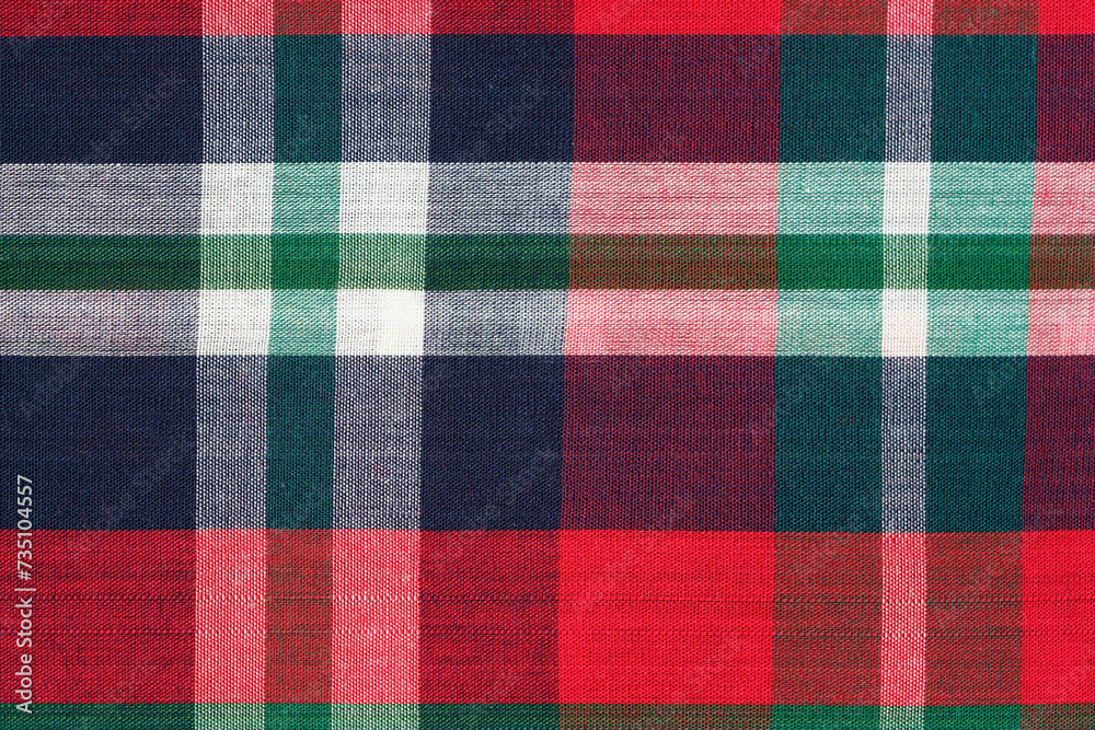 Close-up of a traditional Scottish tartan fabric in red, blue and green colors. Image for your design Close-up of a traditional Scottish tartan fabric in red, blue and green colors. Image for your design
