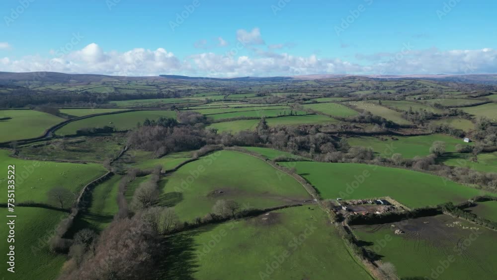 Moretonhampstead, Dartmoor, Devon, England: DRONE VIEWS: The drone flies over a field of grazing sheep. Devon and Dartmoor are major arable and livestock farming areas (Clip 3). Moretonhampstead, Dartmoor, Devon, England: DRONE VIEWS: The drone flies over a field of grazing sheep. Devon and Dartmoor are major arable and livestock farming areas (Clip 3).