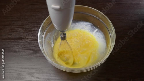 Mixing the eggs with a blender and mixer