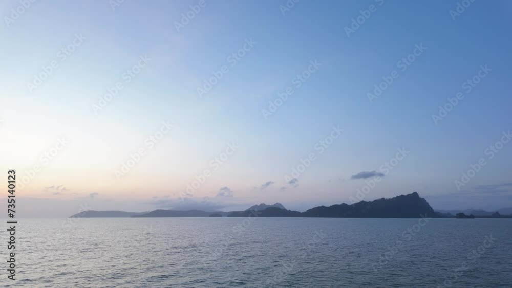 Dawn Serenity: Sea, Sky, and Islands at Early Sunrise Dawn Serenity: Sea, Sky, and Islands at Early Sunrise