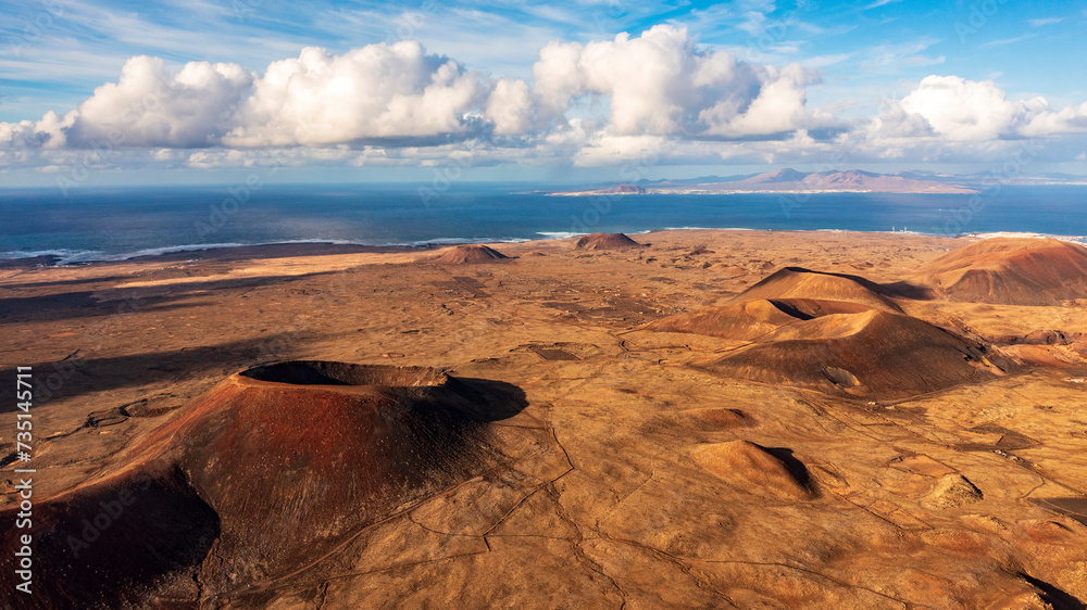 Fototapeta premium Aerial view from above of the crater Calderon Hondo. Calderon Hondo is a volcanic caldera in the sland of Fuerteventura, Canary Islands.
