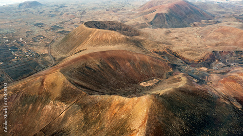 Aerial view from above of the Calderon Bayuyo and Calderon Las Calderas. These little-known volcanoes are found in the sland of Fuerteventura, Canary Islands.