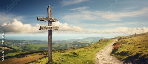 Road sign totem with yellow shell that guides pilgrims along the Camino de Santiago. Creative Banner. Copyspace image photo