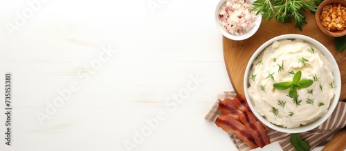 Rolls of fried bacon and mashed potatoes and basil on a plate on the table Top view Web banner. Creative Banner. Copyspace image