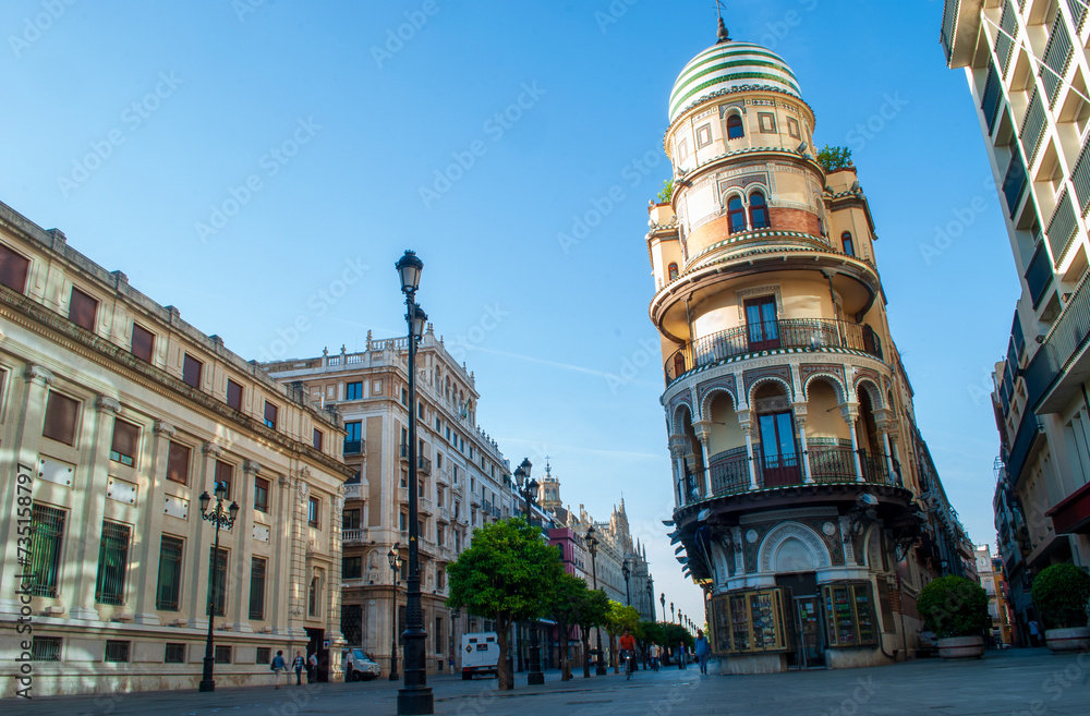 Naklejka premium a blue sky against the backdrop of the architecture of the center of Seville in Andalusia