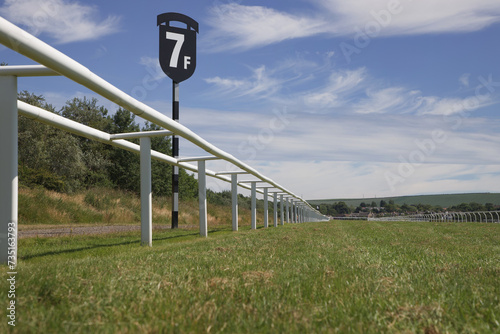 Low angle view of horse racing track