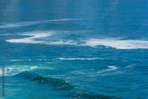 Foto Two tiny surfers cresting an Atlantic Ocean wave along Clarence Drive between Gordon's Bay and Rooi-Els near Cape Town, Western Cape
