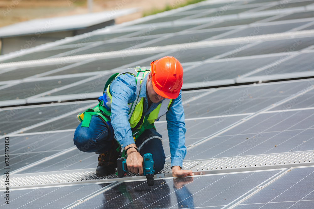 Professional engineer or expert technician working, fixing and used electric drill securing solar system to maintenance system, Renewable energy and alternative sustainable photovoltaic sunlight power Professional engineer or expert technician working, fixing and used electric drill securing solar system to maintenance system, Renewable energy and alternative sustainable photovoltaic sunlight power