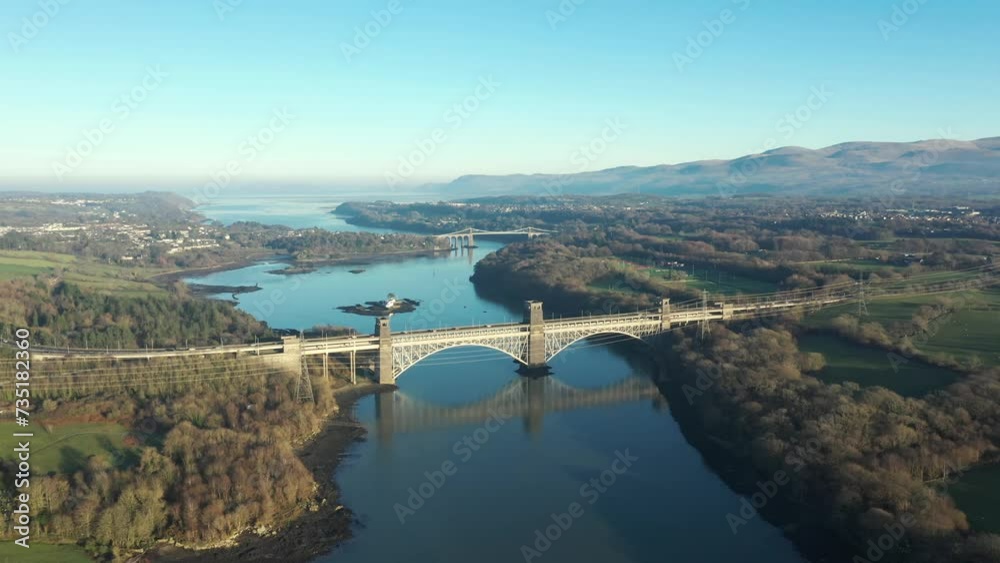 Aerial view of Britannia and Menai bridges in Wales over the Menai strait on a sunny day Aerial view of Britannia and Menai bridges in Wales over the Menai strait on a sunny day