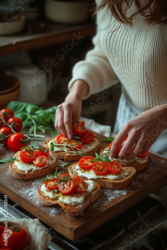 Woman hands makes bruschetta with tomatoes