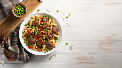 Gourmet Penne Pasta with Succulent Beef - Perfectly cooked penne pasta with succulent beef strips and bright green peas, garnished with fresh herbs