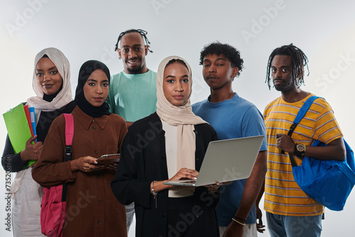 Group of diverse students engages in modern educational practices, utilizing a variety of technological tools such as laptops, tablets, and smartphones against a clean white background, exemplifying