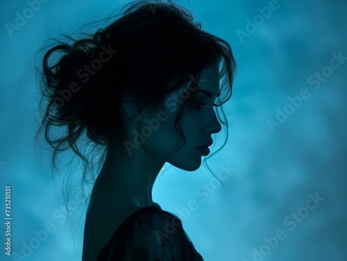 Silhouette of Woman Blue Background