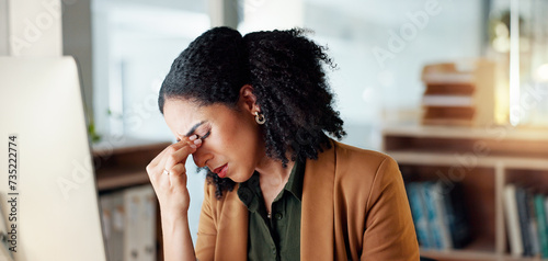 Business woman, headache and stress on computer for Human Resources fail, mistake or payroll error online. Professional african person or HR worker with glasses, pain or sad on desktop for bad news photo