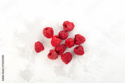 Dried freeze dried raspberries on the table, top view. Dehydrated raspberry berries. Clever Storage healthy food
