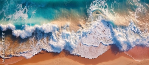 Waves on the beach as a background. aerial view