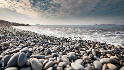 Pebbles on the shore of the sea. Gray smooth stones on the beach. photo