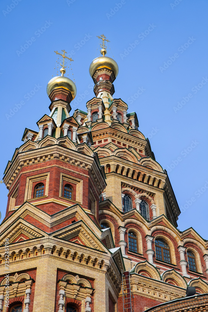 The Cathedral of Saints Peter and Paul is under blue sky, vertical photo