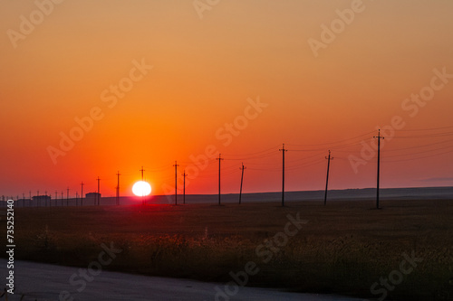 Disk of sun starting its day way close to horizon