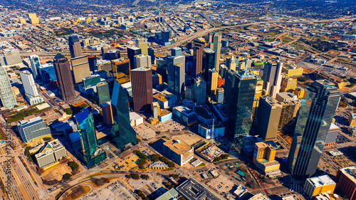An area of beautiful skyscrapers in the uptown of Dallas, Texas, USA. Vast scenery of the city from top on sunny day.