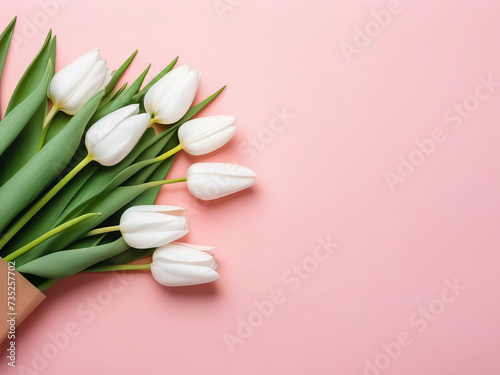 Banner with white tulips wrapped in craft paper on pink pastel background