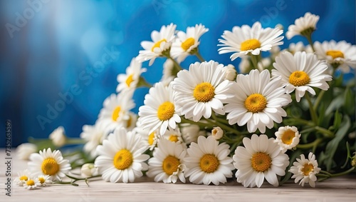 A bouquet of white daisies on the table close up. A festive birthday card, March 8th, a spring gift, summer time.  © Ольга Симонова