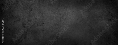 Textured grunge dark black concrete wall background