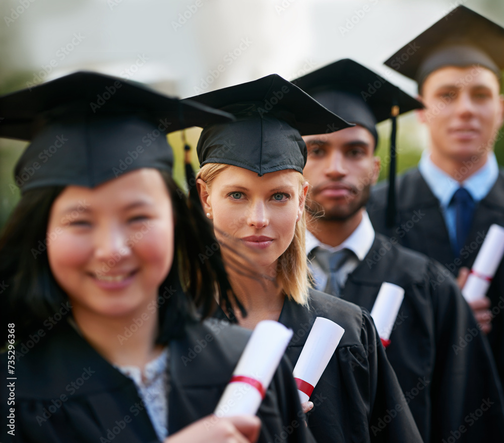 Portrait, graduation and woman in line with friends at college or university for ceremony of achievement. Education, certificate and scholarship with group of young graduate people outdoor on campus Portrait, graduation and woman in line with friends at college or university for ceremony of achievement. Education, certificate and scholarship with group of young graduate people outdoor on campus
