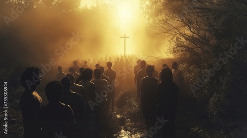 Silhouette of a cross in the middle of a group of people in the dusk.