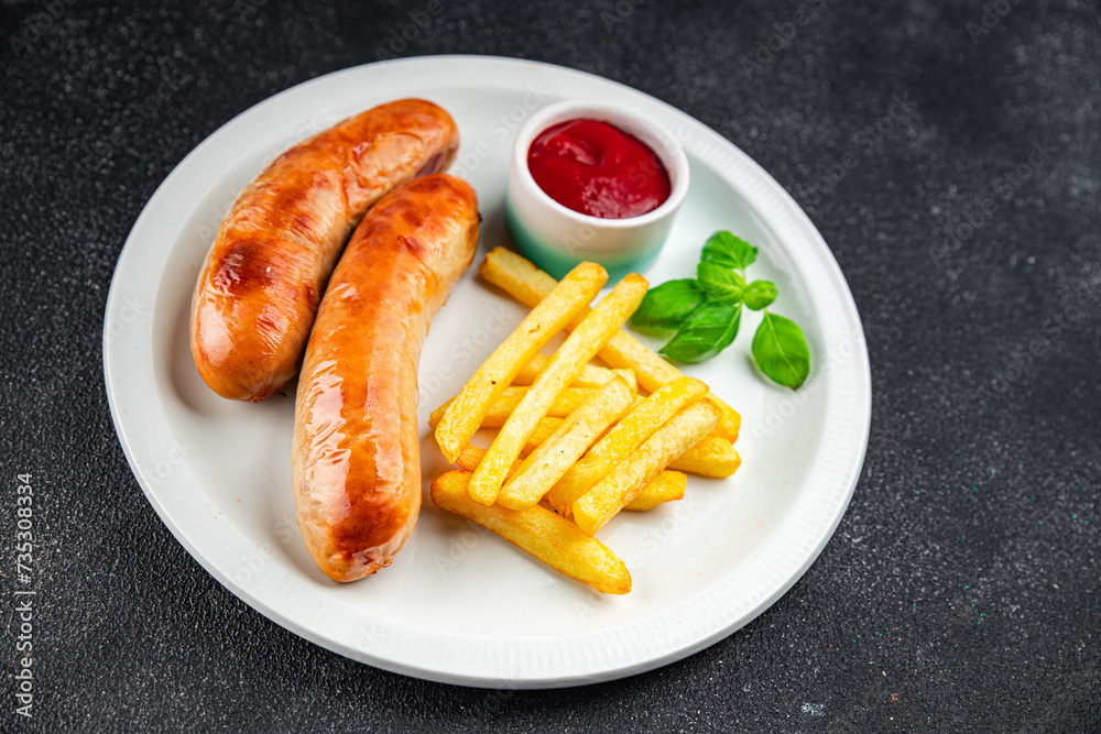 fried sausages and french fries fast food meat and potatoes tasty fresh eating cooking appetizer meal food snack on the table copy space food fried sausages and french fries fast food meat and potatoes tasty fresh eating cooking appetizer meal food snack on the table copy space food
