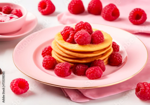 Pancakes with Raspberries  Berries  and Honey on a Pink Plate