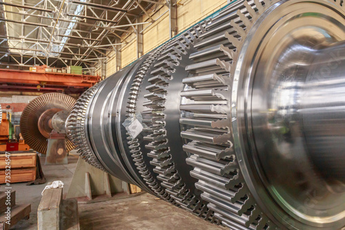 Steam turbine rotor in a factory workshop.
