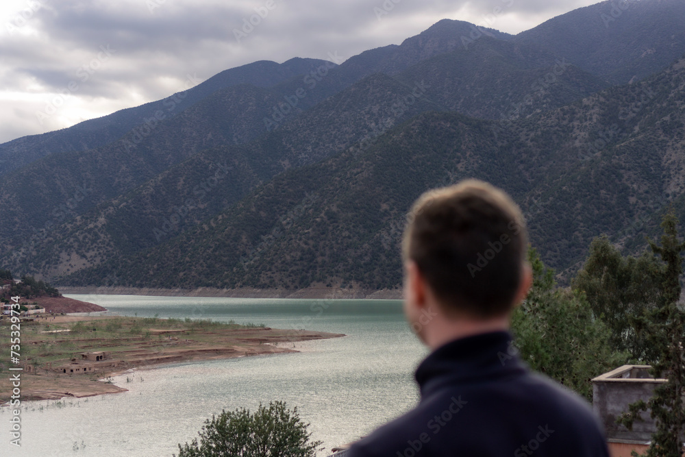 person watching a lake in the Atlas Mountains