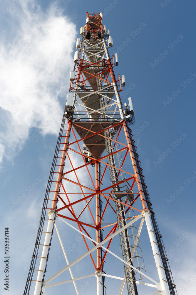 Metal large truss mast with many antennas. Transmission of information via radio channels.